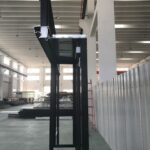 A black lift in an industrial building with no one inside.