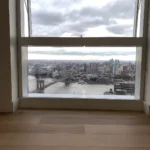 A view of the city from an open window.