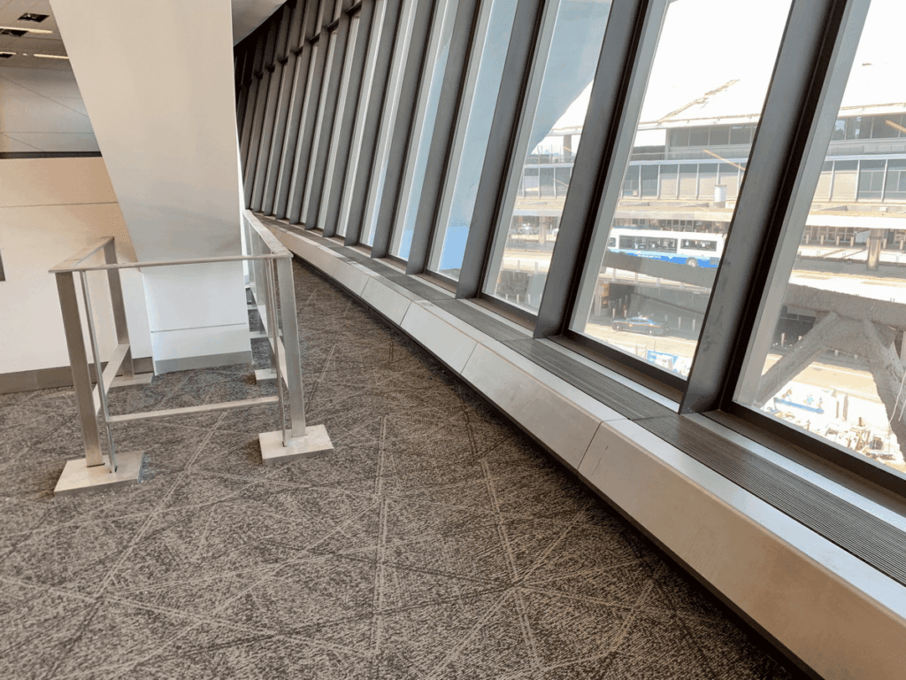 A window sill with some windows in the background