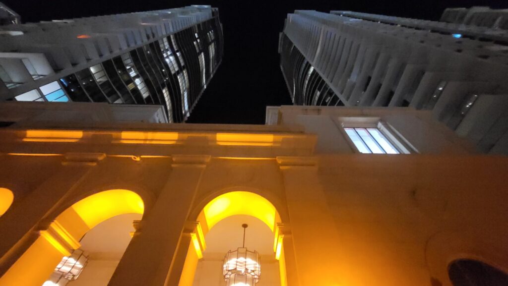 A building with two lights on the top of it