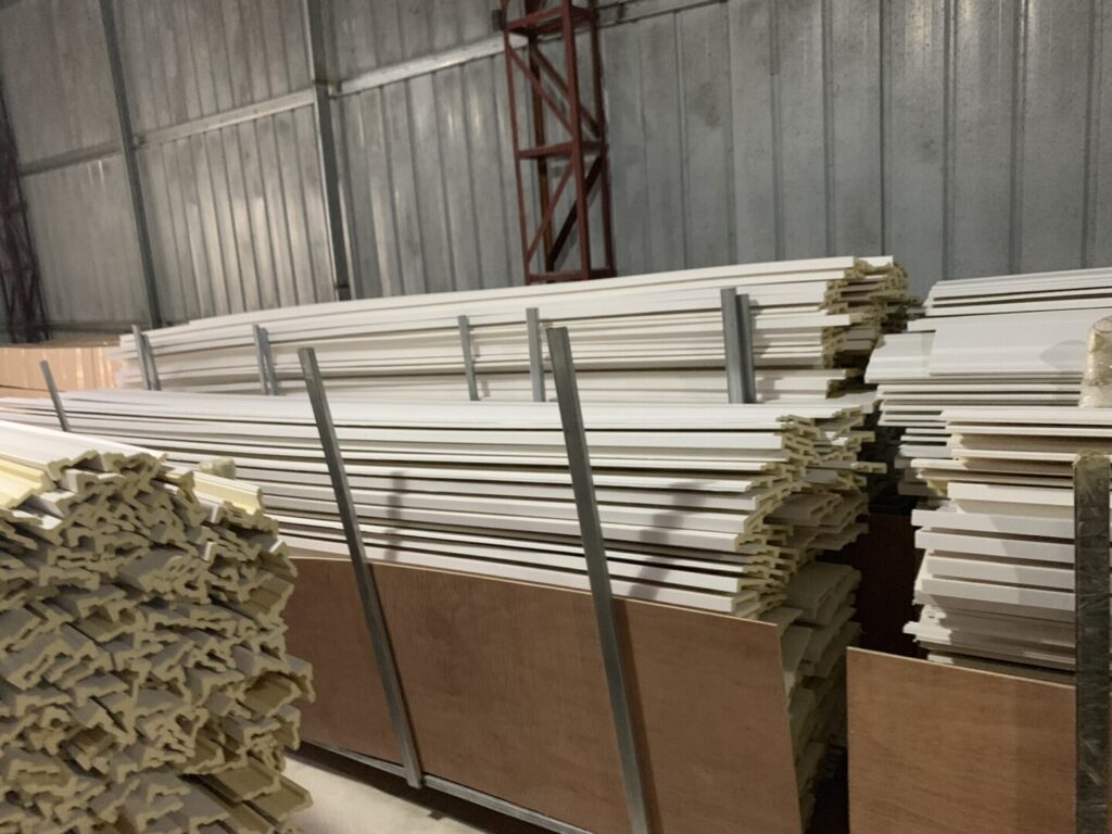 A warehouse filled with lots of wooden boards.