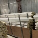 A warehouse filled with lots of wooden boards.