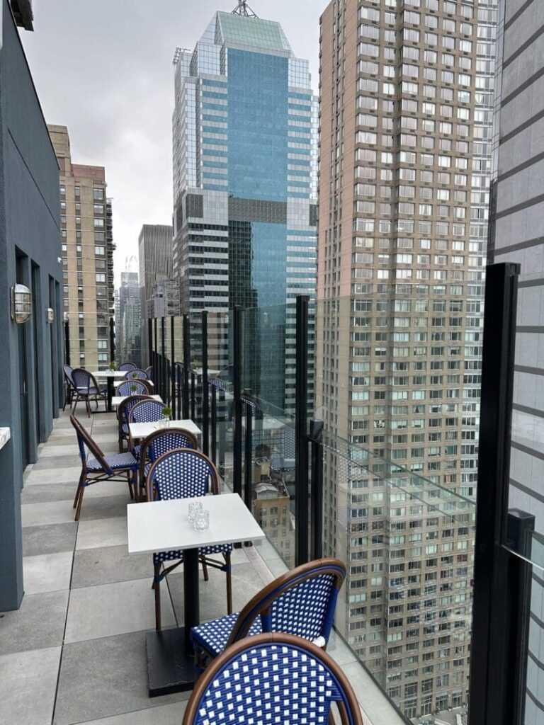 A view of some tables and chairs on the roof.