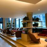 A room with many chairs and tables in it