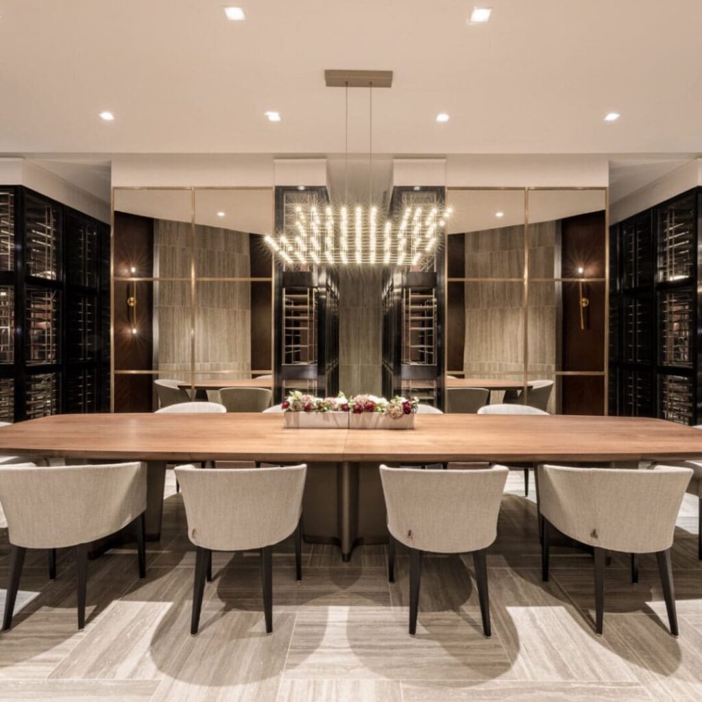 A large dining room table with chairs around it.