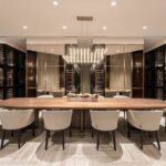 A large dining room table with chairs around it.