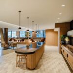 A large kitchen with wooden cabinets and island