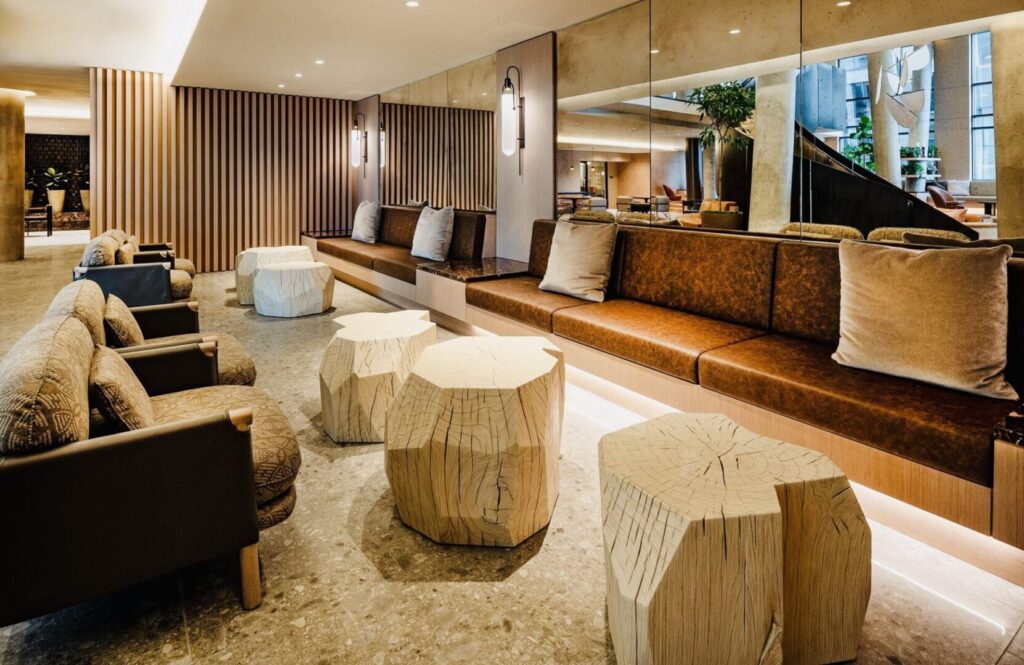 A lobby with many different seating and tables.