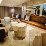 A lobby with many different seating and tables.