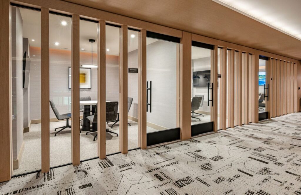 A room with sliding glass doors and a tile floor.
