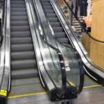 A couple of escalators going down some stairs