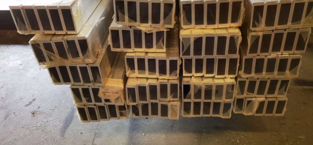 A pile of wooden beams stacked on top of each other.