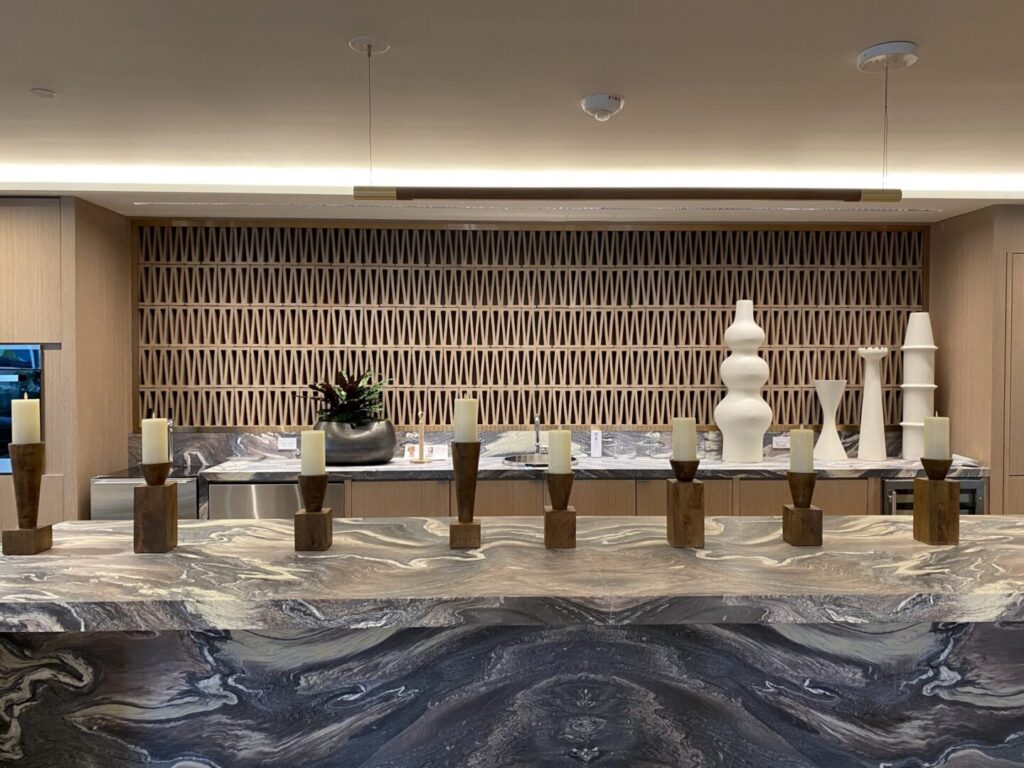 A room with many vases on the counter