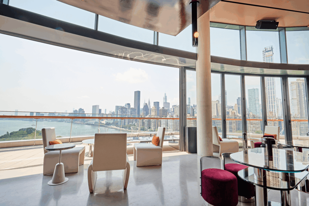 A large open room with a view of the city.