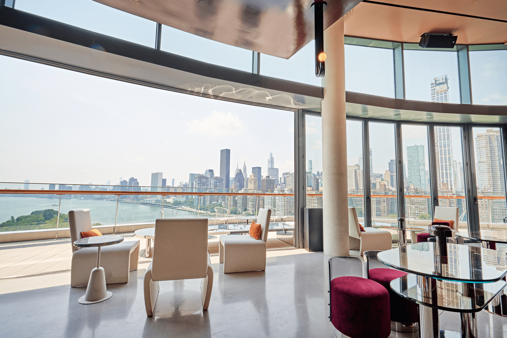A large open room with a view of the city.