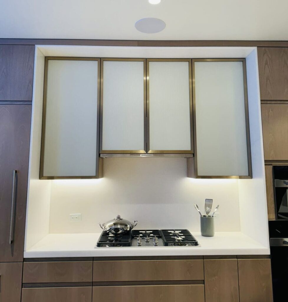 Modern kitchen with built-in stove and sleek cabinetry.
