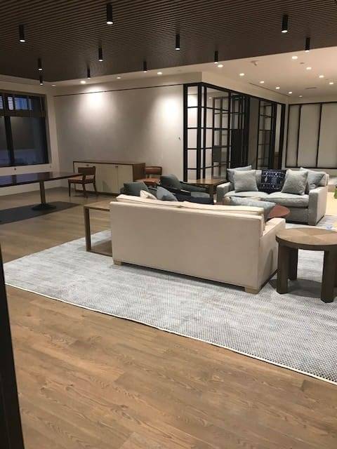 A living room with couches and tables in it