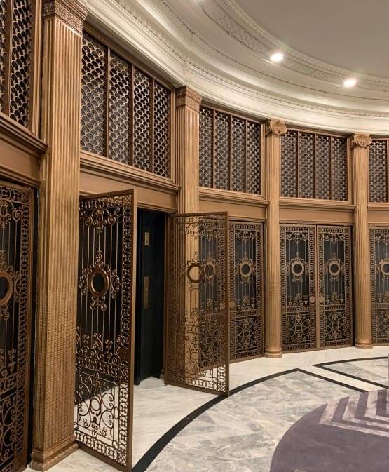 A large room with many doors and some stairs