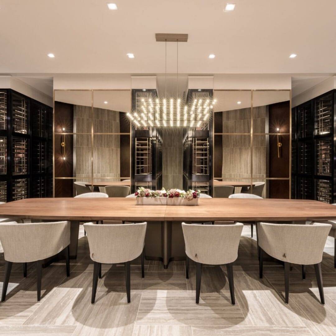 A large dining room table with chairs around it.