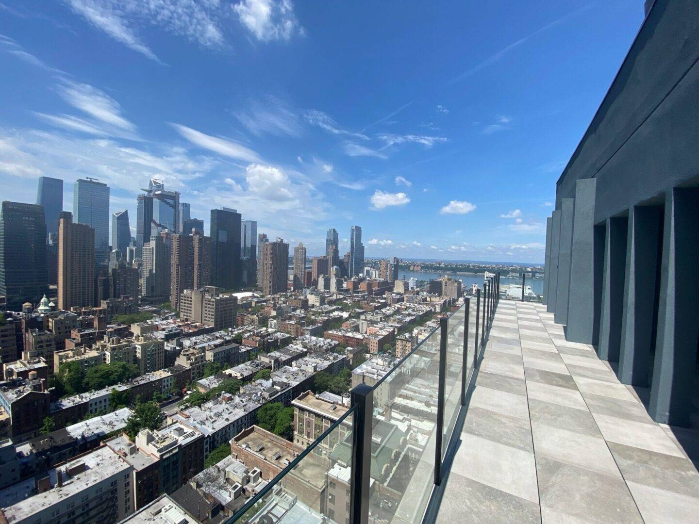 A view of the city from an apartment balcony.